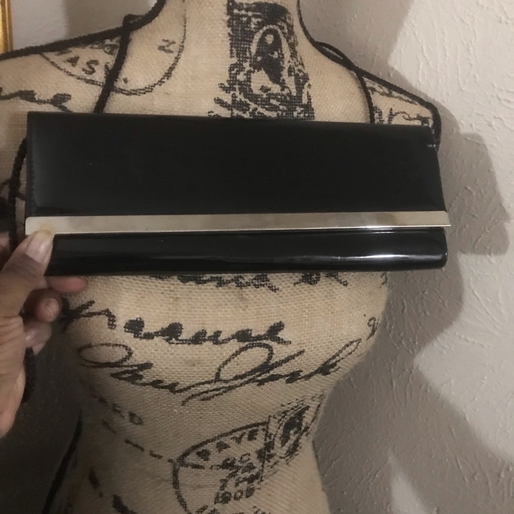 Black patent leather clutch with silver trim